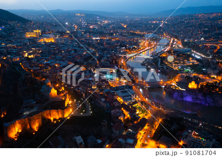 View from drone of Georgian city of Tbilisi at dusk View from drone of Georgian city of Tbilisi at dusk 91081704
