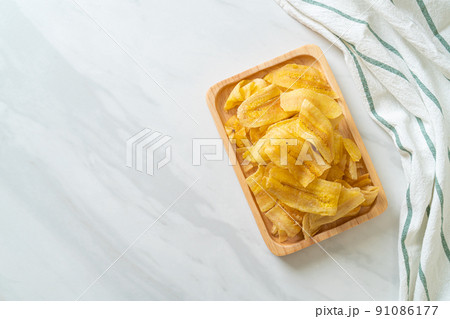Banana Chips - fried or baked sliced banana 91086177