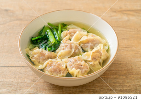 pork wonton soup or pork dumplings soup with vegetable pork wonton soup or pork dumplings soup with vegetable 91086521
