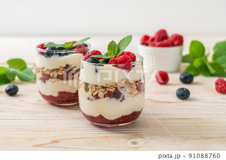 homemade raspberry and blueberry with yogurt and granola homemade raspberry and blueberry with yogurt and granola 91088760