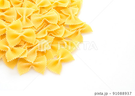 Dry uncooked farfalle pasta on white background 91088937