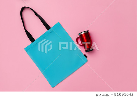 Textile shopping bag and coffee cup flat lay 91091642