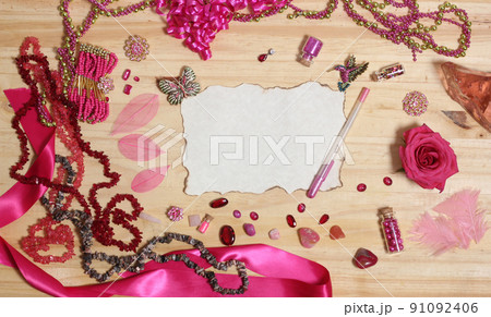Pink and Magenta Jewelry With Rose and Blank Paper With Burned Edges 91092406