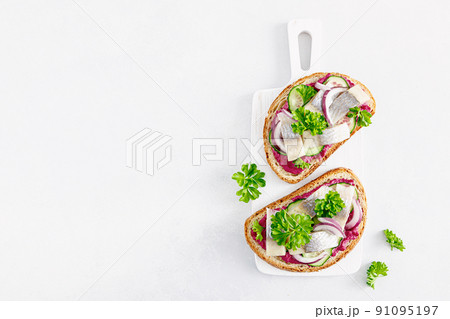 Sandwiches, toasts with salted herring and beetroot pate, top view 91095197