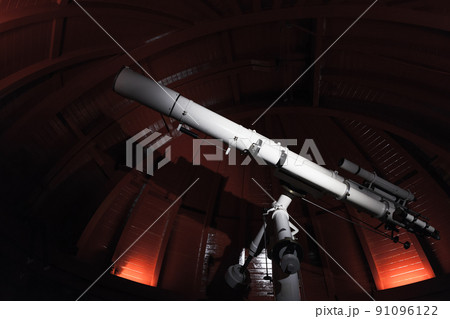 Professional telescope is in an observatory 91096122