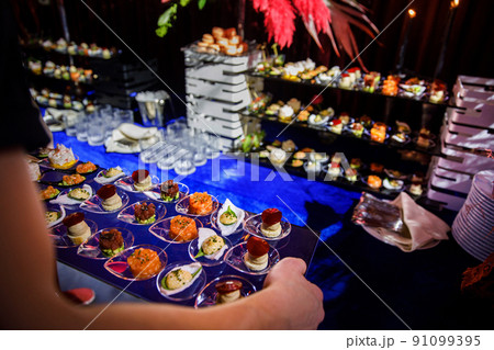Rows of appetizers and starters on the wedding table 91099395
