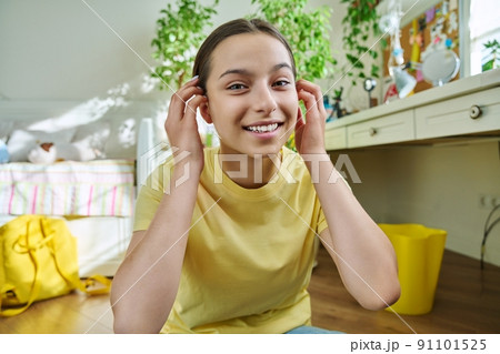 Teenage female student having video call, looking at webcam 91101525