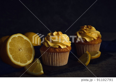 lemon muffins on a dark background lemon muffins on a dark background 91102791