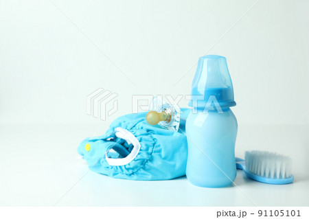 Concept of baby clothes with reusable diapers on white table Concept of baby clothes with reusable diapers on white table 91105101