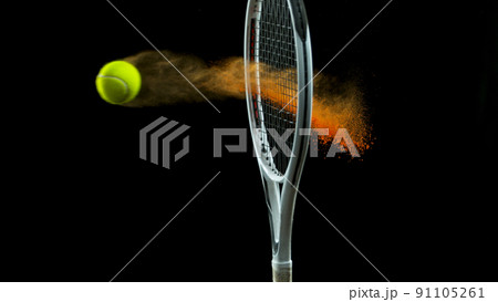 Freeze Motion Shot of Racket Hitting Tenis Ball Containing Orange Powder Freeze Motion Shot of Racket Hitting Tenis Ball Containing Orange Powder 91105261