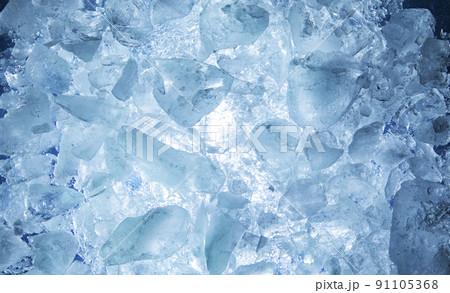 Abstract ice texture. A network of cracks on a piece of blue ice Abstract ice texture. A network of cracks on a piece of blue ice 91105368