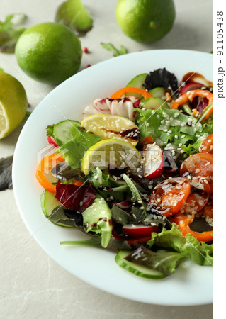 Concept of tasty food with vegetable salad with tahini sauce close up Concept of tasty food with vegetable salad with tahini sauce close up 91105438