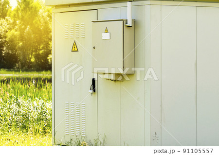 Outdoor electric distribution cabinet with a morning sunlight Outdoor electric distribution cabinet with a morning sunlight 91105557