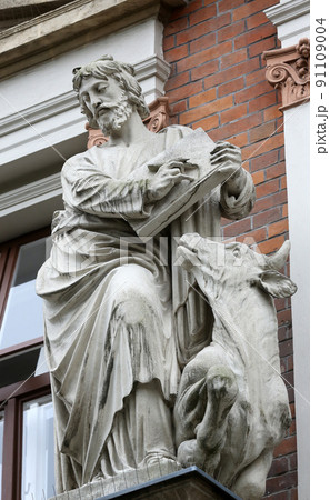 Saint Luke the Evangelist on the facade of Evangelical School in Vienna, Austria 91109004