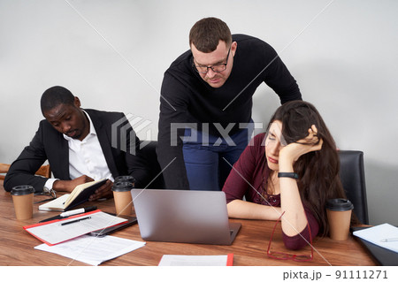 Young happy business people working together in modern office, multiethnic teamwork Young happy business people working together in modern office, multiethnic teamwork 91111271