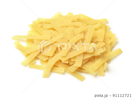Pile of uncooked short cut ribbon pasta 91112721