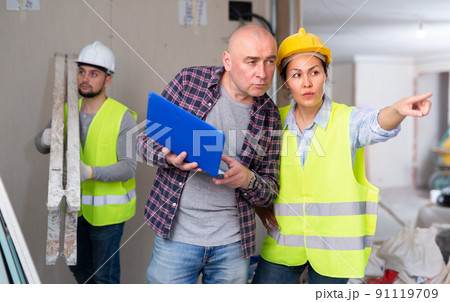 Architect and engineer discussing work in construction site Architect and engineer discussing work in construction site 91119709