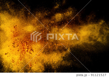 Explosion, Splashes of turmeric on a black background. India Seasoning. The orange powder of the turmeric root. 91121527