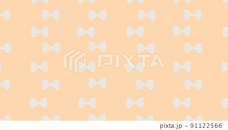 Full frame shot of white vector bow ties against peach background 91122566