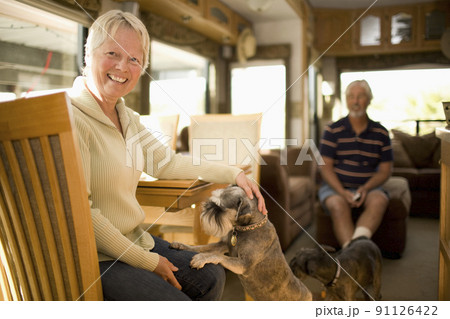 Senior couple wit dog in mobile home Senior couple wit dog in mobile home 91126422