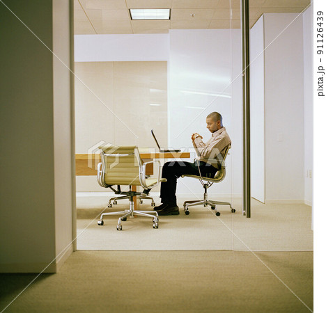 Businessman in conference room 91126439