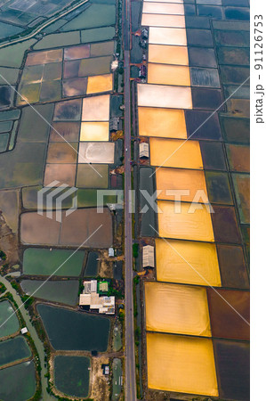 Aerial view of Salt Farms in the village of Laem Phak Bia in Phetchaburi, Thailand Aerial view of Salt Farms in the village of Laem Phak Bia in Phetchaburi, Thailand 91126753