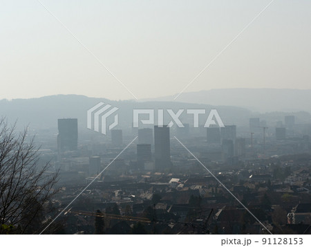 Zurich, Switzerland - March 26th 2022: View from Zuerichberg over the city with skyscrapers Zurich, Switzerland - March 26th 2022: View from Zuerichberg over the city with skyscrapers 91128153