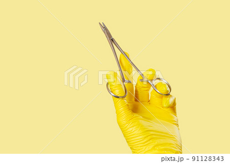 Woman's hand with medical tool in the white background 91128343