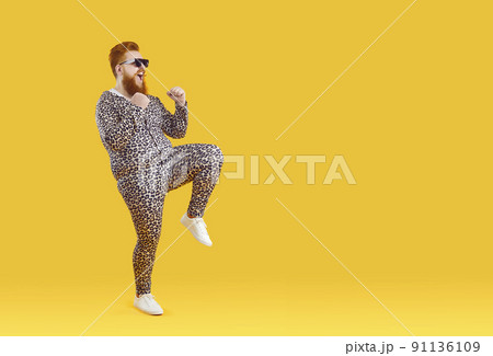 Funny fat man in pajama dancing 91136109