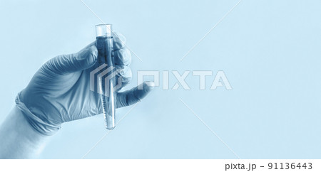 Hand of scientist in blue gloves with test tube on blue background. Medical laboratory testing, analysis and research. Chemistry, science, biology experiment technology, pharmacy. Banner Hand of scientist in blue gloves with test tube on blue background. Medical laboratory testing, analysis and research. Chemistry, science, biology experiment technology, pharmacy. Banner 91136443