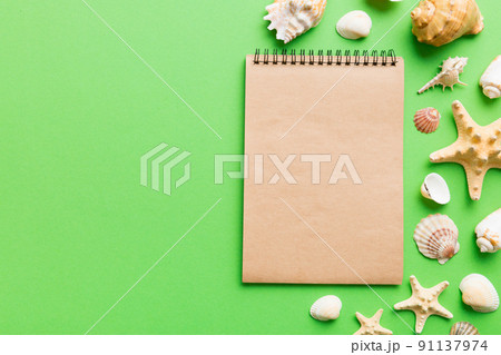 Blank writing book with summer beach accessories on background, copy space. Flat lay with copy space Blank writing book with summer beach accessories on background, copy space. Flat lay with copy space 91137974