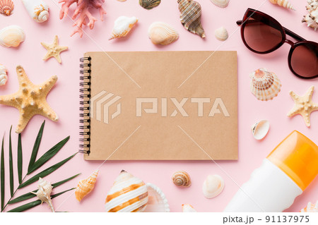 Blank writing book with summer beach accessories on background, copy space. Flat lay with copy space Blank writing book with summer beach accessories on background, copy space. Flat lay with copy space 91137975