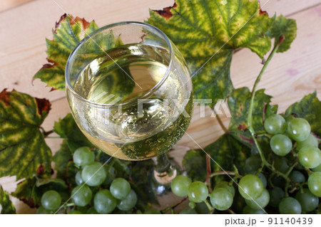 Grape and wine on table Grape and wine on table 91140439