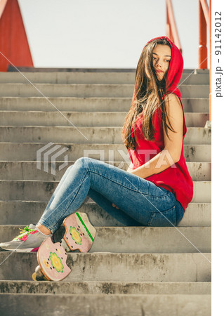 Skate girl on stairs with skateboard. Skate girl on stairs with skateboard. 91142012