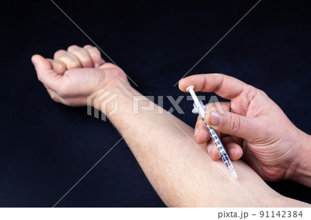 drug addict with a syringe drug addict with a syringe 91142384