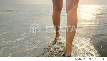 closeup of woman walking feet 91143091