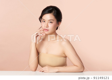 Beautiful young asian woman with clean fresh skin on beige background, Face care, Facial treatment, Cosmetology, beauty and spa, Asian women portrait. Beautiful young asian woman with clean fresh skin on beige background, Face care, Facial treatment, Cosmetology, beauty and spa, Asian women portrait. 91149121