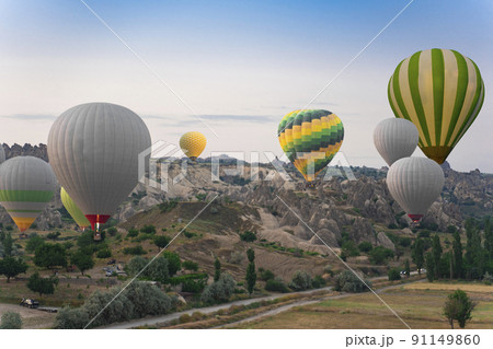 Cappadocia balloons in turkey. Balloons at dawn in the valley of love. 91149860