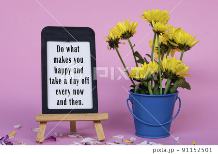 Motivational and inspirational quote on note paper with frame and flowers. Motivational and inspirational quote on note paper with frame and flowers. 91152501