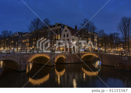 Amsterdam, Netherlands bridges and canals at twilight. Amsterdam, Netherlands bridges and canals at twilight. 91155567