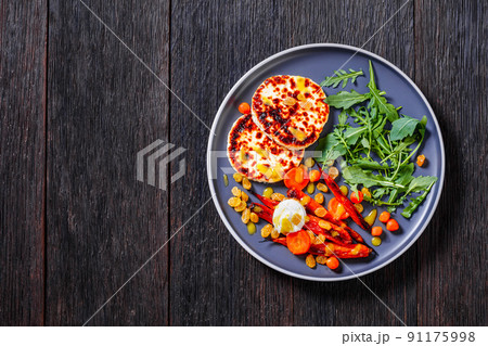 baby carrot salad and grilled halloumi cheese 91175998
