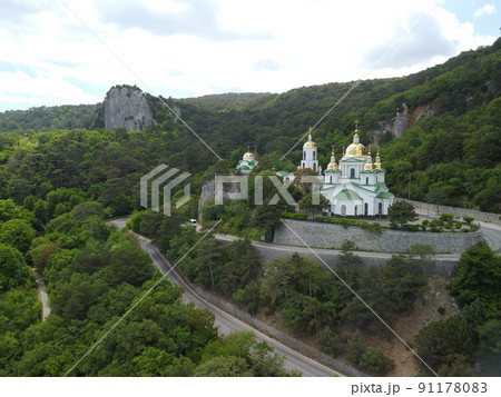 Christian church in the mountains above the sea. Temple of the Holy Archangel Michael in Oreanda. The southern coast of Crimea. Aerial view Christian church in the mountains above the sea. Temple of the Holy Archangel Michael in Oreanda. The southern coast of Crimea. Aerial view 91178083