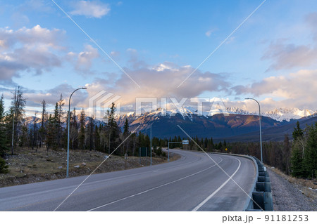 Trans-Canada Highway 16, Yellowhead Highway, Alberta Provincial Highway No. 16 in dusk. Canadian Rockies, Jasper National Park, Canada. Trans-Canada Highway 16, Yellowhead Highway, Alberta Provincial Highway No. 16 in dusk. Canadian Rockies, Jasper National Park, Canada. 91181253