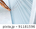 Using a key to open a rolling iron door. 91181596