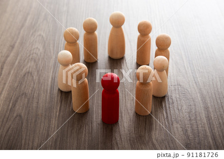 Wooden people figures on top of wooden blocks. Career growth, development and leadership 91181726