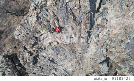 Rock climbing training on steep slope in mountains Rock climbing training on steep slope in mountains 91185425