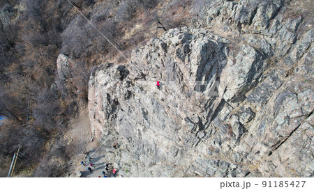 Rock climbing training on steep slope in mountains 91185427