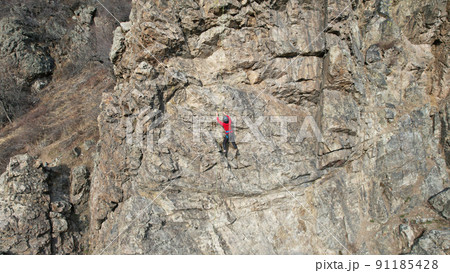 Rock climbing training on steep slope in mountains Rock climbing training on steep slope in mountains 91185428