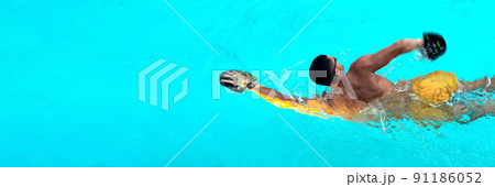 Man swimming with crawl in the pool. Triathlon fitness athlete swimming training. Swimmer person floating in turquoise water banner panorama. Sports and fitness cardio exercises. Panorama banner. Man swimming with crawl in the pool. Triathlon fitness athlete swimming training. Swimmer person floating in turquoise water banner panorama. Sports and fitness cardio exercises. Panorama banner. 91186052