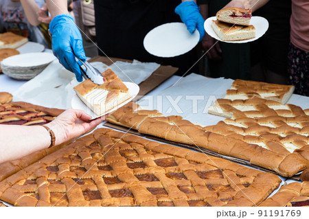 placing portion of sweet cheese pie in plate 91191769